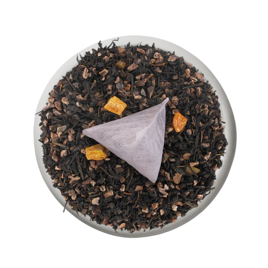 Boîte de thé personnalisée avec infusette et motifs colorés.