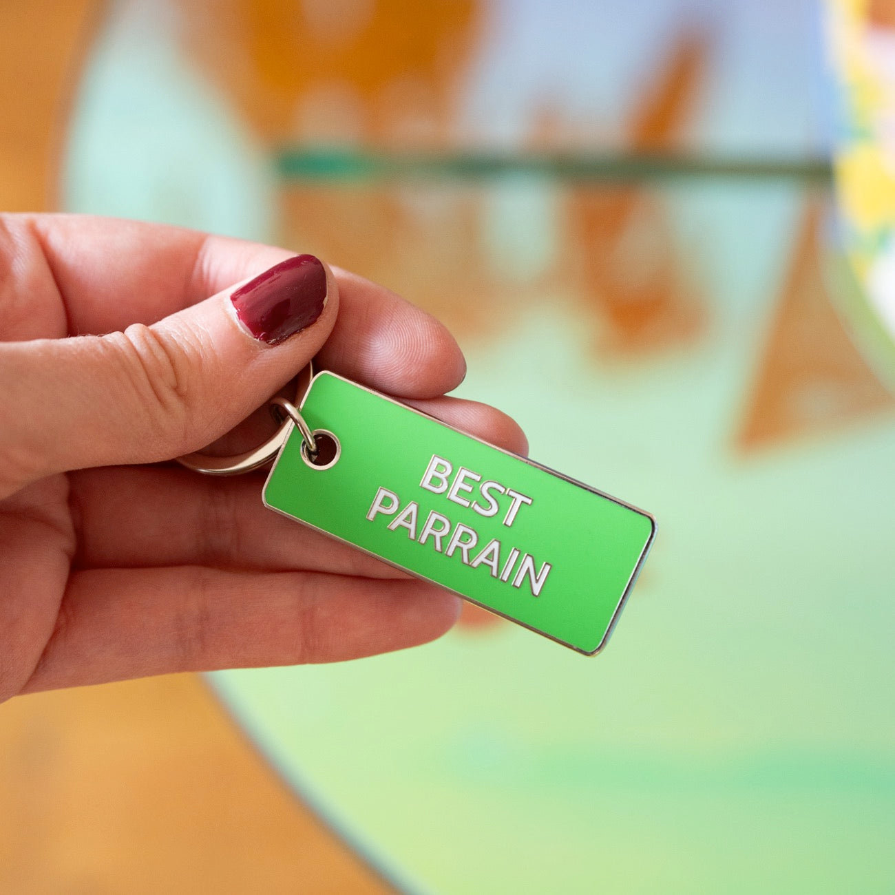 Porte-clé 'Meilleur Parrain' avec inscription humoristique.