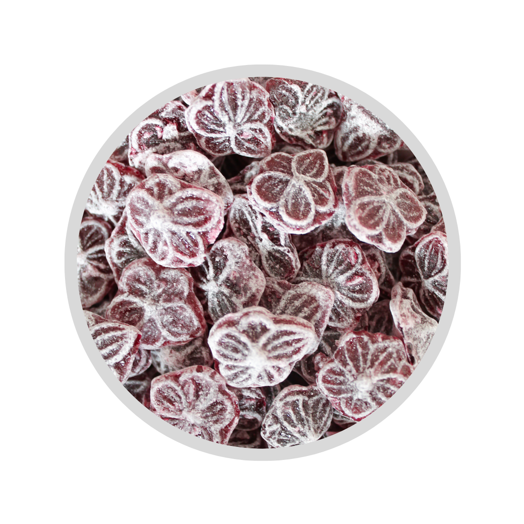 Boîte de bonbons personnalisés avec motif coloré sur le couvercle.